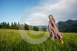 Beautiful dreadlock woman in mountains