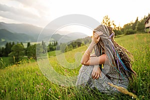 Beautiful dreadlock woman in mountains