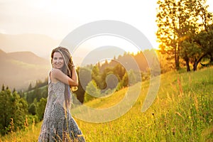 Beautiful dreadlock woman in mountains