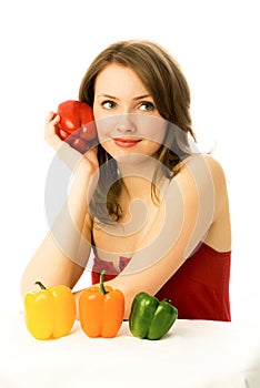 Beautiful dreamy woman with colorful peppers