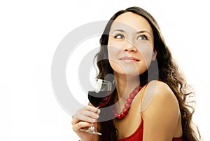 Beautiful dreamy woman with a glass of vine