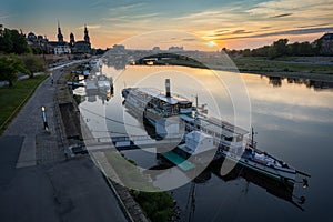 Beautiful Dresden city skyline at Elbe River and tourism pleasure steamship on pier, Dresden, Saxony, Germany