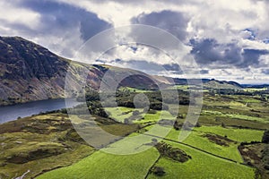 Beautiful drone view over Lake District landscape in late Summer, in Wast Water valley with mountain views and dramatic sky