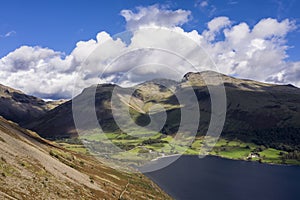 Beautiful drone view over Lake District landscape in late Summer, in Wast Water valley with mountain views and dramatic sky