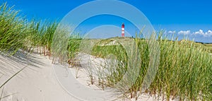 Beautiful dune landscape with traditional lighthouse at North Sea, Schleswig-Holstein, North Sea, Germany