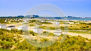 The beautiful dunes with beach cottages and touristy beach, Breskens, Zeeland, The Netherlands photo