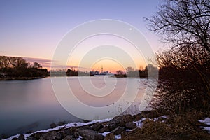 Beautiful dusk colors over Humber Bay, with the full moon rising over the Toronto skyline and CN Tower