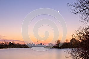 Beautiful dusk colors over Humber Bay, with the full moon rising over the Toronto skyline and CN Tower