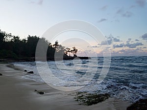 Beautiful Dusk over the ocean with waves moving to shore