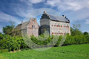 Beautiful dutch countryside landscape, green agriculture field, medieval Hasselholt castle - Ohe en Laak, Netherlands photo