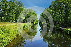 Beautiful dutch water canal Eindhovensche Kanaal through green forest, cycling bike path