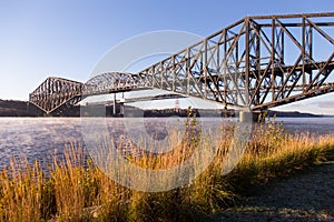 Beautiful early morning view of the 1919 steel Quebec Bridge over the St. Lawrence river