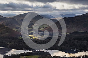 Beautiful early Winter morning landscape view from Latrigg Fell in Lake District across Dewentwater towards Little Town and