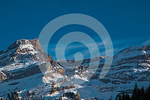 Beautiful early winter panorama of Oldenhorn mountain above Les Diablerets village in Switzerland on a sunny day