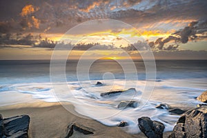 Beautiful east coast sunrise on a rocky beach