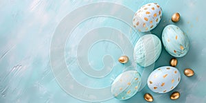 Beautiful Easter background of painted light blue easter eggs with golden decorations. Festive greeting card