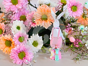 Beautiful Easter bunnie with flowers as a decoration for the Easter holiday