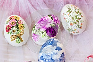 Beautiful Easter eggs decorated with paper napkins and flowers; decoupage technique