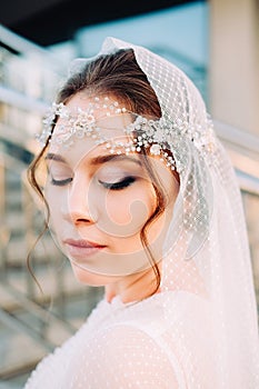 Beautiful eastern style bride with white veil and hairpiece
