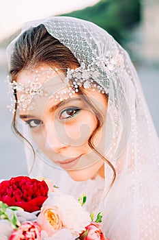 Beautiful eastern style bride with white veil and hairpiece