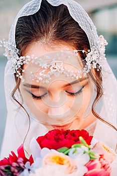 Beautiful eastern style bride with white veil and hairpiece