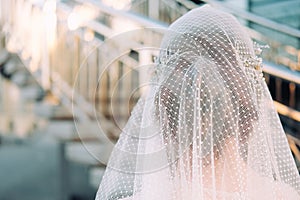 Beautiful eastern style bride with white veil and hairpiece