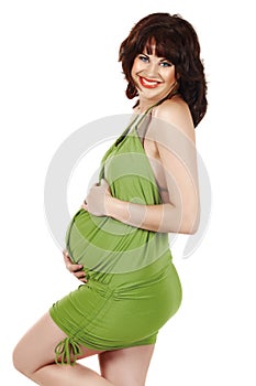 Beautiful eight months pregnant brunette woman