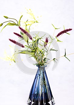 Beautiful Ekibana of lily flowers in a blue vase