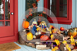 Beautiful elaborate Halloween display on a pretty blue and red patrimonial house porch