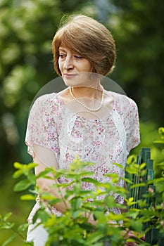 Beautiful elderly woman in beads