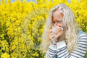 Beautiful elderly Woman has to sneeze