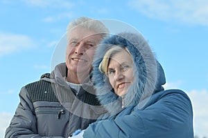 Beautiful elderly woman smiling against the sky