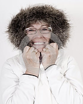 Beautiful elderly woman in white winterclothes