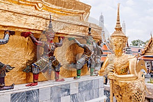 Golden and coloured giant guardian statue of Bangkok Grand Palace building - Wat Phra Kaew photo