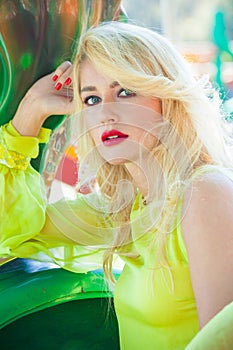 Beautiful elegant blonde fashion woman portrait in amusement park summer