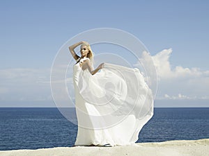 Beautiful elegant bride at the seashore