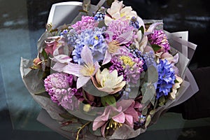 Beautiful elegant designer pink purple blue bouquet of florist close-up. Floral background