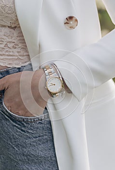 Beautiful elegant white watch on woman hand. Close-up photo