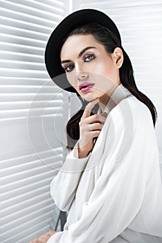 beautiful elegant woman in beret and white