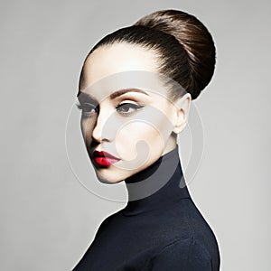 Beautiful elegant woman in black turtleneck