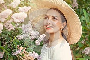 Beautiful elegant woman with flowers outdoor
