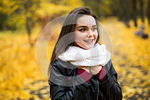 Beautiful elegant woman standing in a park