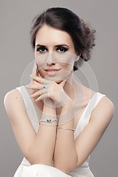 Beautiful Elegant Woman in White Dress Wearing Jewelry