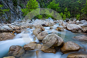 Emerald rushing mountain river scene