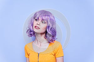 Beautiful and emotional model purple hair isolated background