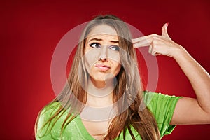 Beautiful emotional woman over red background