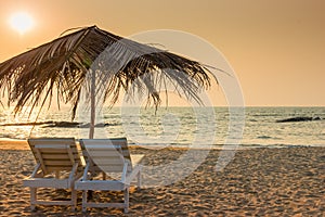 Beautiful empty beach and a pair of loungers