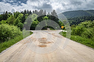 Beautiful empty macadam road with crossroads, in cerknica, Slovenia