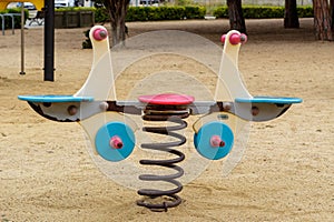 Beautiful empty park for children with a colorful small playground on the sand