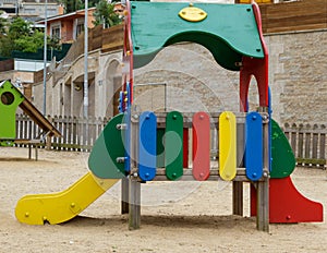 Beautiful empty park for children with a colorful small playground on the sand